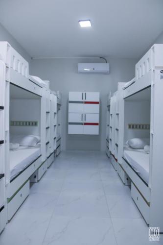 Postel nebo postele na pokoji v ubytování MANERO POUSADA e HOSTEL