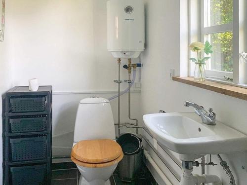 a bathroom with a toilet and a sink at 8 person holiday home in Holbæk-By Traum in Holbæk