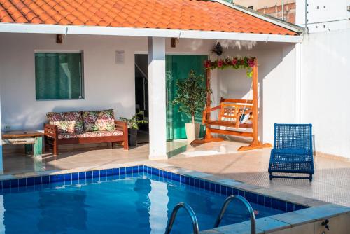 a house with a swimming pool and a patio at CASA TORRES in Bonito