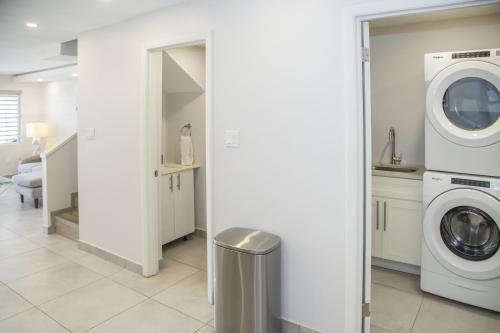 a laundry room with a washer and dryer at 246D South Finger in Jolly Harbour