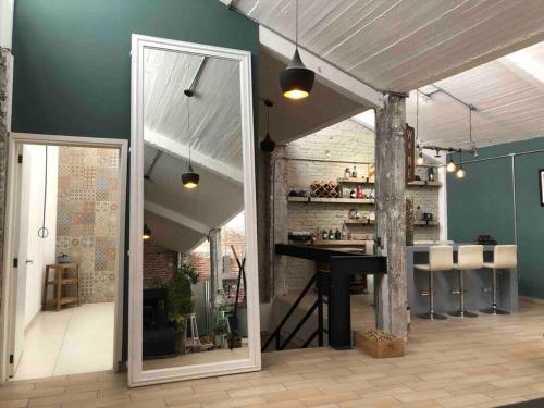 a room with a table and a counter in a room at Loft Condesa in Mexico City