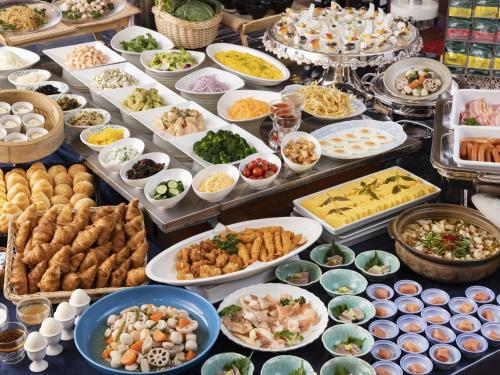 a buffet filled with different types of food on a table at Ark Hotel Royal Fukuoka Tenjin -ROUTE INN HOTELS- in Fukuoka