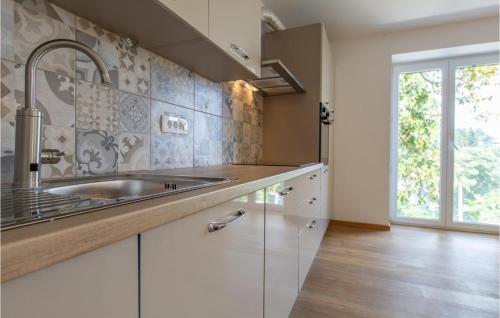 a kitchen with a sink and a window at Nice Apartment In Portoroz With Wifi And 2 Bedrooms in Portorož