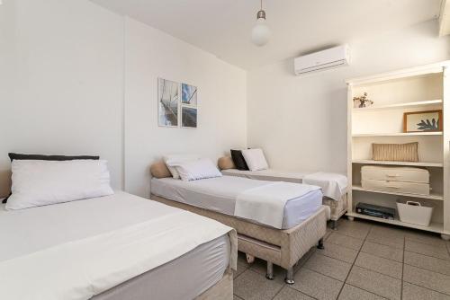 Кровать или кровати в номере Apartamento 3 quartos +2 garagens+2 banheiros a 40m da Praia dos Ingleses/florianopolis