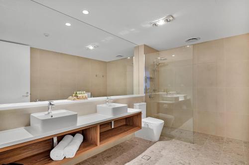 a bathroom with two sinks and a shower at The Remington Orange in Orange