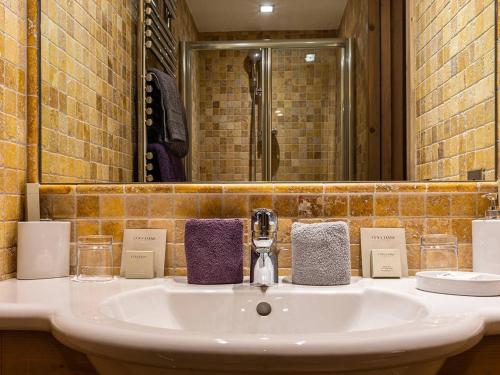 a bathroom with a sink and a mirror at Appartement Courchevel, 4 pièces, 6 personnes - FR-1-631-165 in Courchevel