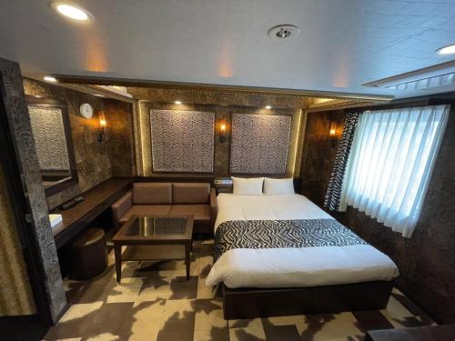 Ένα ή περισσότερα κρεβάτια σε δωμάτιο στο Hotel LiVEMAX Umeda Central