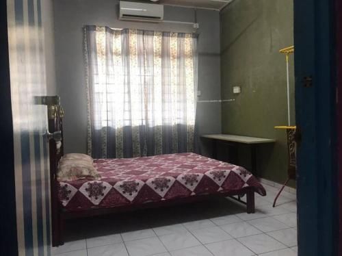 Katil atau katil-katil dalam bilik di D'Mangga Homestay