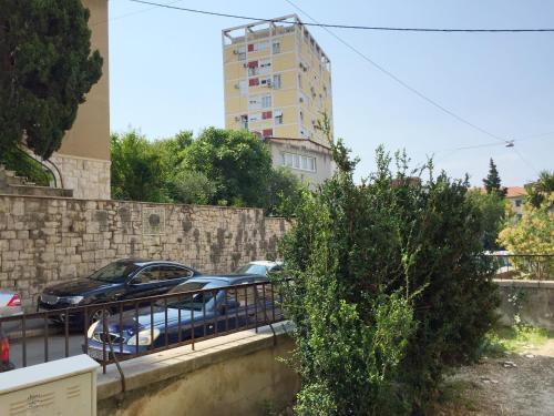 a car parked in a parking lot next to a building at Apartment Martea in Split