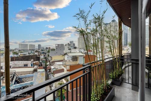 a balcony with a view of a city at KunKin Garden Aparthotel in Ho Chi Minh City