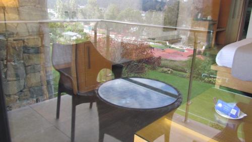a view of a room with a bed and a window at Mountain Retreat Kodai in Kodaikānāl