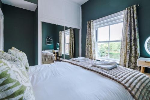 a bedroom with a white bed and a window at 1B Victorian Retreat in Chester in Chester