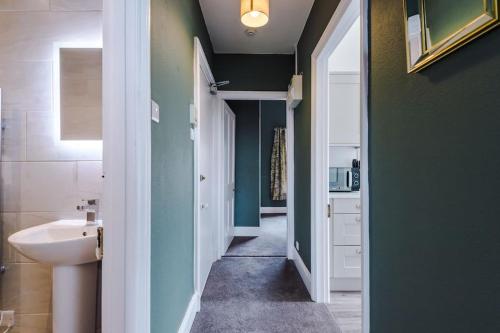 a bathroom with a sink and a toilet in it at 1B Victorian Retreat in Chester in Chester