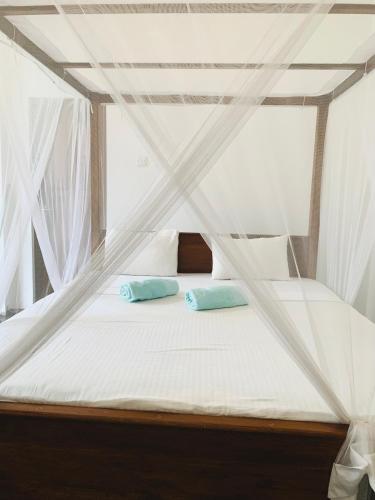 Ένα ή περισσότερα κρεβάτια σε δωμάτιο στο Surf Home Stay Hiriketiya