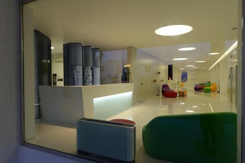 a view of a lobby with a waiting room with chairs at Giulivo Hotel & Village in Baia Domizia