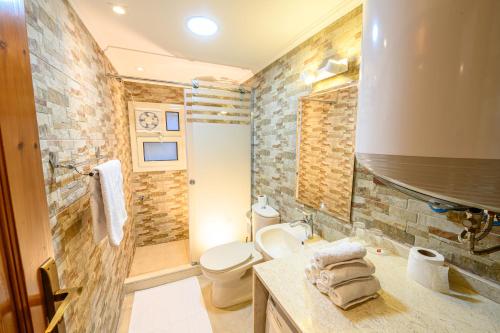 a bathroom with a sink and a toilet in a room at Rhapsody of Luxor in Luxor