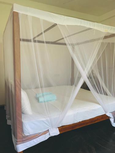 Ένα ή περισσότερα κρεβάτια σε δωμάτιο στο Surf Home Stay Hiriketiya