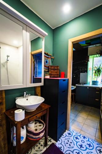 a bathroom with a sink and a mirror at Kabina in Pakruojis