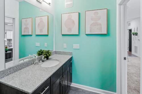 a bathroom with a sink and a mirror at South Asheville Getaway Private Balcony Apt 1 in Arden