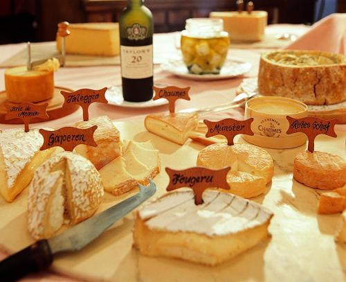 a table topped with lots of different types of food at Sporthotel Lorünser in Zürs am Arlberg