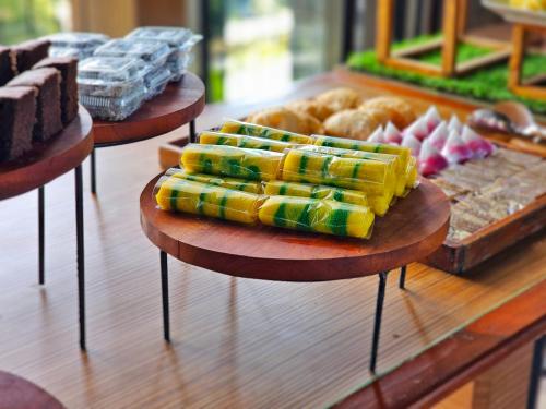 a buffet with different types of food on display at The Batu Hotel & Villas in Batu