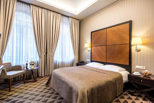 Voodi või voodid majutusasutuse VICTORIA Hotel Kaunas toas