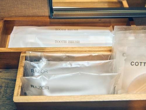 a drawer filled with styrofoam containers and food at ルクス箱根湯本 LUX HAKONE YUMOTO in Hakone