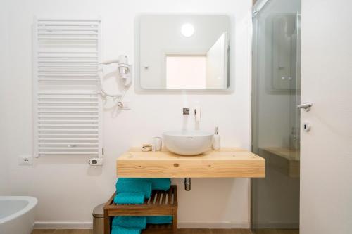 a bathroom with a sink and a mirror at Casa Del Barone - Luxury Suites in Monopoli