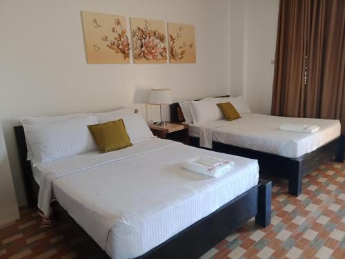 Postel nebo postele na pokoji v ubytování TAM-AN HOTEL BANAUE