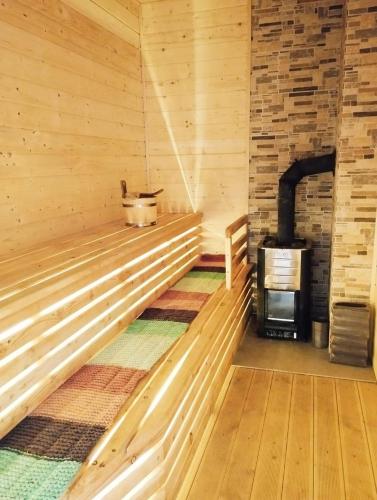 a room with a sauna with a stove at Cisza i Spokój in Szczawnica