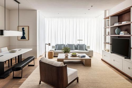 a living room with a couch and a table at R48 Hotel and Garden in Tel Aviv