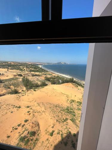 a window view of the desert and the ocean at Apec mandala Mũi Né in Ấp Khánh Phước (1)
