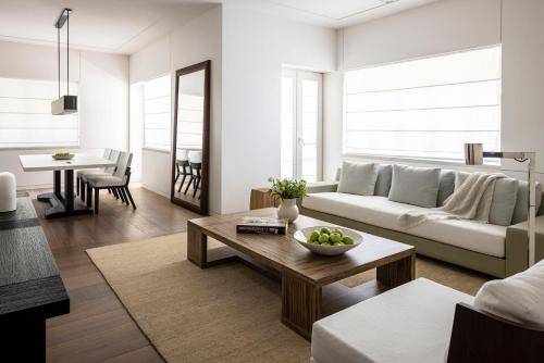 a living room with a couch and a table at R48 Hotel and Garden in Tel Aviv