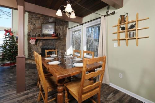 a dining room with a wooden table and chairs at Heavenly View 2308 in Gatlinburg