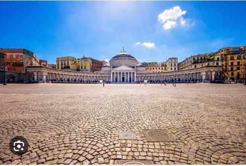 a large building with a domed building in the background at La casa di Sarah aspetta voi in Naples