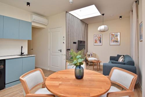 a living room with a table and a couch at Boutique Scheveningen beach apartment in Scheveningen