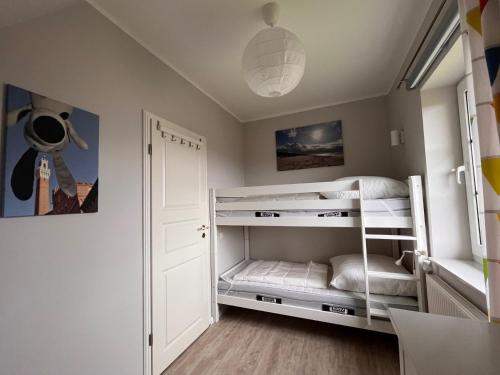 En eller flere senge i et værelse på Friesenhaus Vier Jahreszeiten