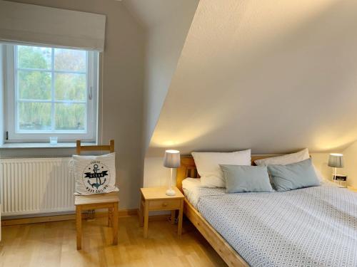 En eller flere senge i et værelse på Strandhaus Brasilien