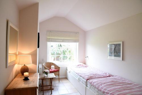 En eller flere senge i et værelse på Ostseetraum