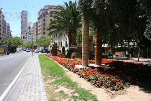 a row of flowers on the side of a street at Mendez Nuñez Alicante in Alicante