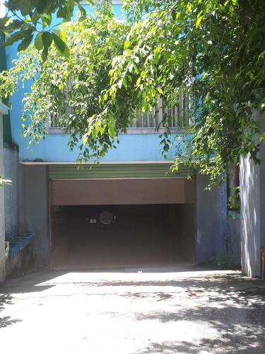 a large garage under a building with a window at Nhà nghỉ 99 