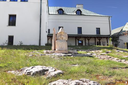 a statue of a bear in front of a building at Karczówka Klasztor in Kielce