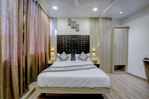 a bedroom with a large bed in a room at Arts International in Mumbai