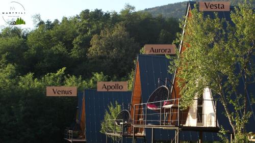 a building with signs on the side of it at Inn Martvili in Martvili