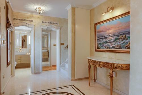 a bathroom with a sink and a mirror at Aphrodite Hills Rentals - Mythos Collection Villas in Kouklia