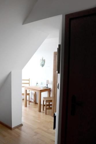 a room with a table and a dining room at Karczówka Klasztor in Kielce