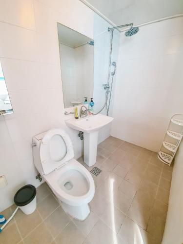 a white bathroom with a toilet and a sink at Fall in the view in Seoul