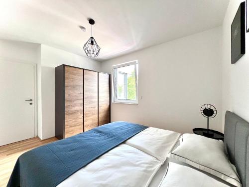 Säng eller sängar i ett rum på Apartment Schönbrunn