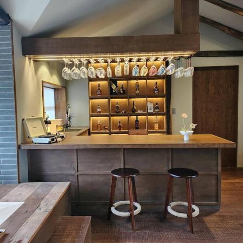 a counter with two stools in front of a store at Peace of mind in Jeju