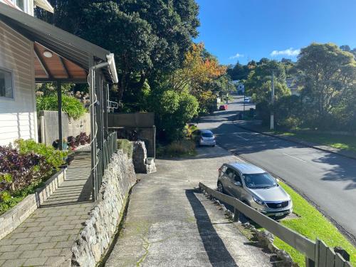 a car parked outside of a house on a street at BBs B&B in Lower Hutt
